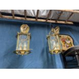 A Pair of vintage lantern ceiling lights fitted with bevel glass sections.