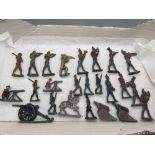 Antique lead soldiers which includes three lead canon's and one horse back soldier.
