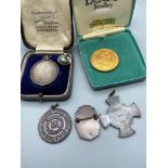 A quantity of vintage medals which includes Birmingham silver Scottish Command Cup Final SGMN