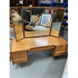 A Retro mid century teak pedestal dressing table with three way mirror. [136x137x51cm]