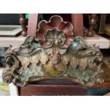 A 17th century hand carved wooden finial panel showing signs of original paint work. Centre panel