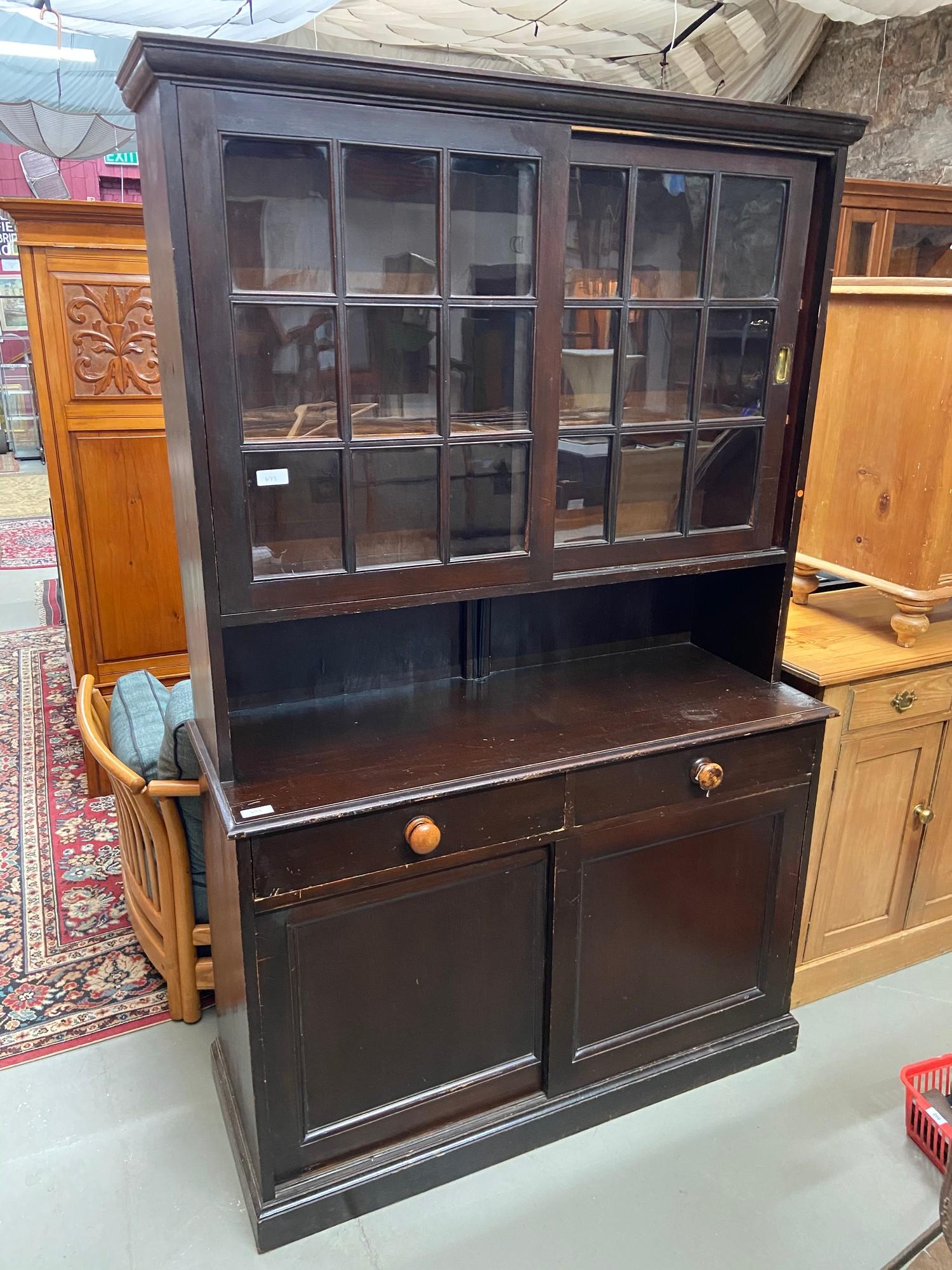A Large Victorian glazed dresser. Sliding wood and glass doors to the top. Two under drawers and two