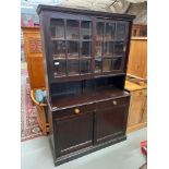A Large Victorian glazed dresser. Sliding wood and glass doors to the top. Two under drawers and two