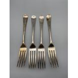 A Lot of four Georgian London table forks. Three dated 1812 and one dated 1805. All have bales of