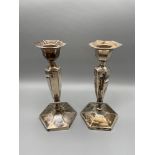 A Pair of Birmingham weighted candle sticks. Produced by Henry Clifford Davis and dated 1918. [17.