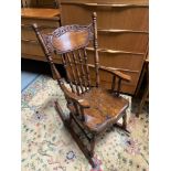 An American child's rocking arm chair.