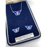 A 925 silver and enamel butterfly pendant attached with a silver chain and matching earrings.