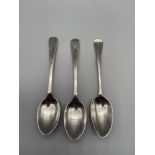 Three various Sheffield silver tea spoons. Two matching ornate spoons are produced by Fenton
