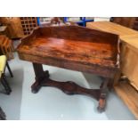 A Victorian mahogany console table/ writing desk. Designed with two under drawers.