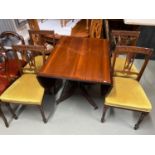 A Lot of four Victorian Rosewood framed dining chairs together with a mahogany drop end dining table