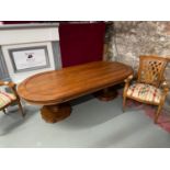A Large reproduction carved dining table supported on two large single pedestals. Together with