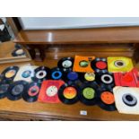 A Quantity of 45 rpm records to include Thin Lizzy, Alice cooper, Wings, Rod Stewart, Elton John and