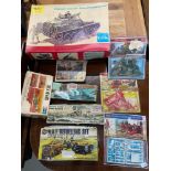 A Collection of vintage military model kits which includes makes Heller, Airfix and Revell.