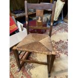 A Child's Vintage rocking chair, designed with a Military style dog inlay to the back support.