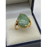 A Lovely example of a hand made 18ct gold [Unmarked] ladies ring set with a large Jade oval stone.