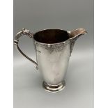 A Nice example of a Birmingham silver cream jug designed with Celtic dragon handle and trims.