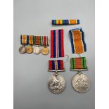 A WW2 War & Defence medals [No Names] Together with a four bar miniature medal set [WW1 & WW2]