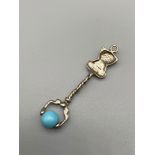 A Novelty Child's bear and blue bead roller pendant. [5.5cm length]