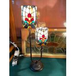 A Two tier Tiffany style table lamp. In a working condition. [74cm height]