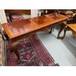 A Large hardwood console table designed with ball and claw feet supports. Together with matching