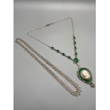 A Vintage ladies silver 925 suffragette style necklace designed with green stones, carved cameo