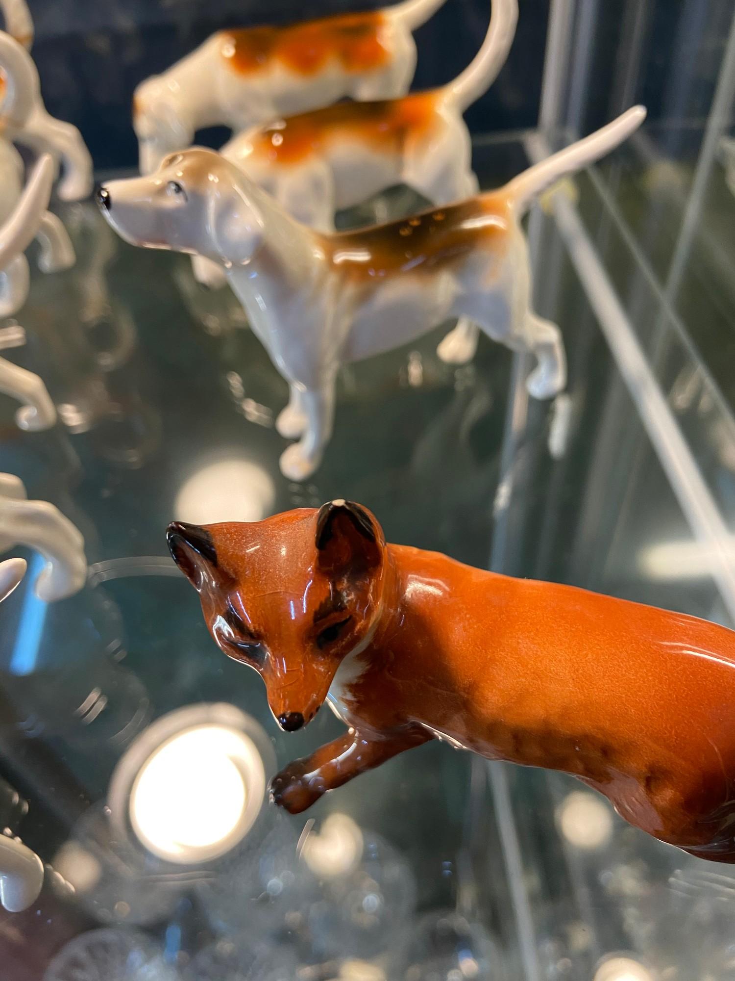 A Shelf of Beswick animals which includes Fox, bugle hunting dogs and sheep. - Image 2 of 3