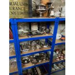 4 Shelves full of silver plated and E.P ware which include large serving tureen and ladle, Ornate