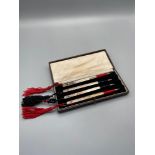A Set of four boxed Sterling Silver & enamel bridge propelling pencils. Designed with black and
