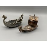 A Japanese Sterling silver novelty pepper pot in the shape of a sailing boat. Together with a pewter