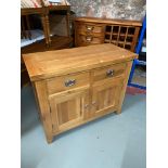 A Contemporary solid light oak small sideboard
