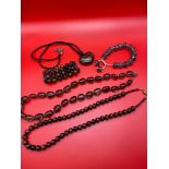 A Lot of gem stone jewellery which includes three items of tiger eye jewellery. Smokey style bead