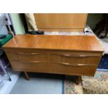 A Mid century teak pedestal four drawer chest. [70.5x121x40.5cm]