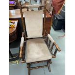 Antique American rocking arm chair.