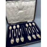 A Boxed set of 12 London silver tea spoons with matching sugar tongs, Produced by Josiah