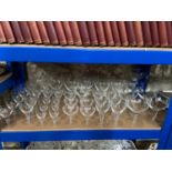 A Shelf of antique twist stem wine, port and sherry glasses.