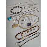 A Collection of silver jewellery which includes Pendants, Earrings, bracelets and necklaces.