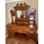 A Large Victorian lounge dresser, designed with large mantel mirror and shelving back. Showing
