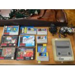 A Vintage Super Nintendo Snes console with various boxed and unboxed games. Games Include Star Wars,