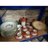 A Shelf containing an Art deco Victoria coffee set, Floral design bowl and various ornate serving