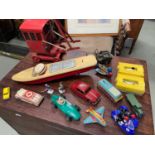 A Quantity of vintage tin plate and other car, boat models, Includes Tri-Ang crane, Tin battery