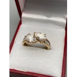A Nice example of a ladies 9ct gold evening ring designed with two CZ tear drop stones off set by