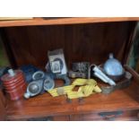 A Shelf of military collectables to include gas mask, Photos, Belts, Pouches and water flask