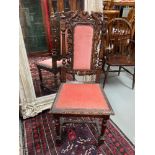 A Gothic design Victorian highly carved bedroom chair/ lounge chair.