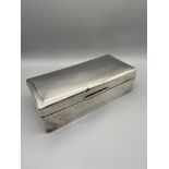 A Large London silver cigarette box. Produced by William Comyns & Sons. Dated 1915. [5.5x19.5x9cm]