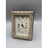 A 925 Silver framed battery clock.