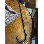 An Antique walking stick designed with an 18ct gold collar.