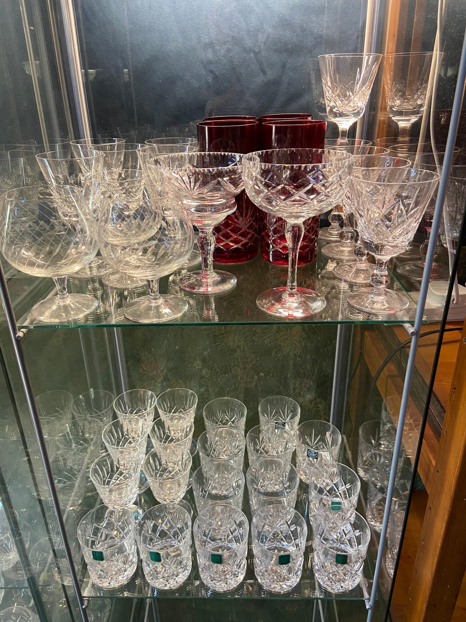 Two shelves of collectable crystal to include Edinburgh whisky glass set of 6, Stuart Crystal port