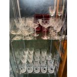 Two shelves of collectable crystal to include Edinburgh whisky glass set of 6, Stuart Crystal port