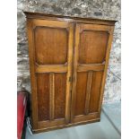 Antique solid oak travel wardrobe, fitted with hangers, drawers and mirrors. Also has an interior