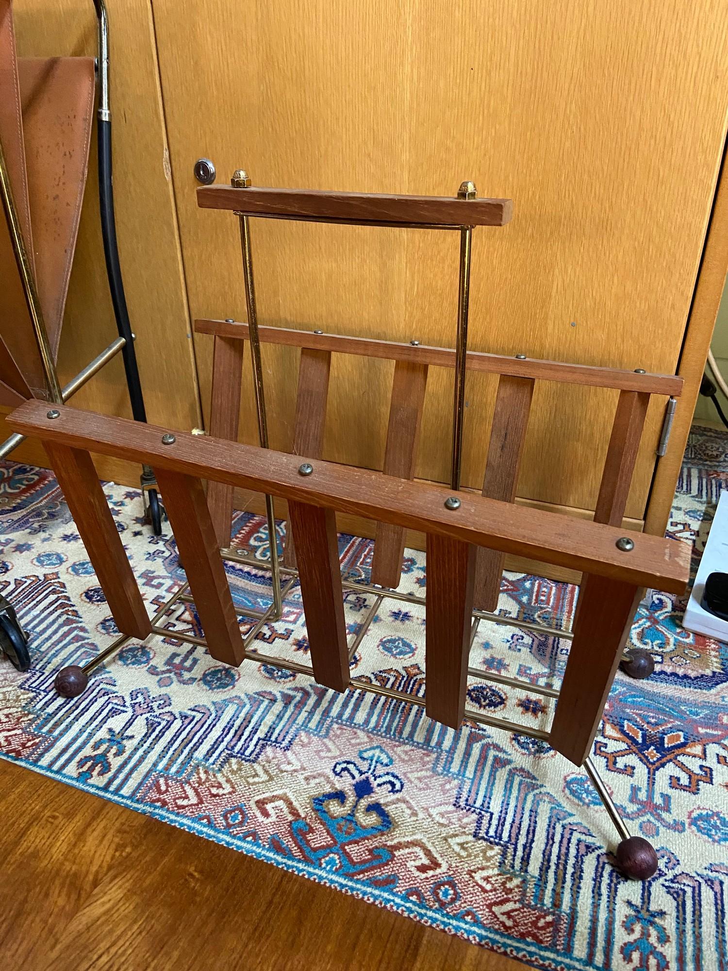 A Mid century teak and metal frame magazine rack.